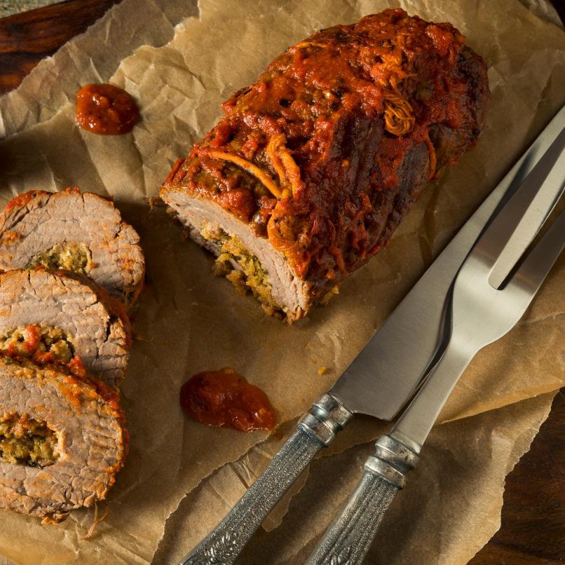 A meat roulade filled with herbs and vegetables